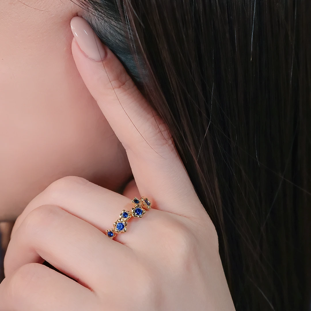 Melted gold petals blue sapphire ring